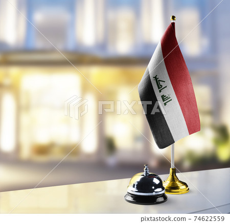 Iraq flag on the reception desk in the lobby of the hotel Iraq flag on the reception desk in the lobby of the hotel 74622559