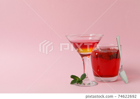 Concept of dessert with red jelly on pink background Concept of dessert with red jelly on pink background 74622692