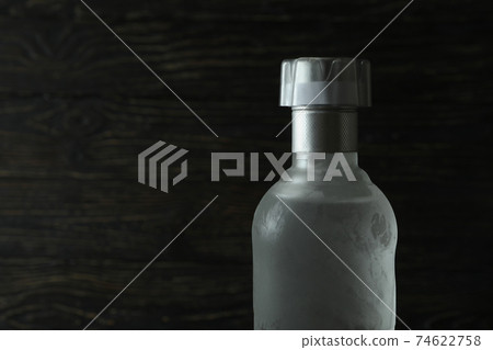 Blank bottle of vodka on wooden background, space for text Blank bottle of vodka on wooden background, space for text 74622758