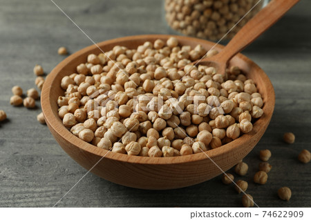 Bowl, jar and spoon with chickpea on gray table Bowl, jar and spoon with chickpea on gray table 74622909