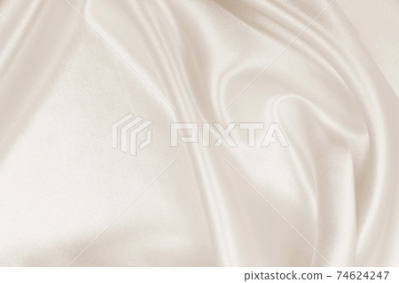 Smooth elegant golden silk or satin luxury cloth texture as wedding background. Luxurious background design. In Sepia toned. Retro style Smooth elegant golden silk or satin luxury cloth texture as wedding background. Luxurious background design. In Sepia toned. Retro style 74624247