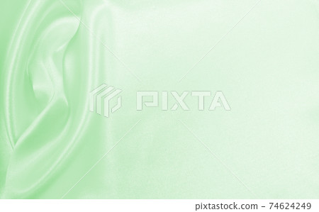 Smooth elegant green silk or satin luxury cloth texture as abstract background. Luxurious background design Smooth elegant green silk or satin luxury cloth texture as abstract background. Luxurious background design 74624249