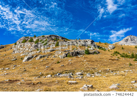 Landscape view of Col de la Cayolle pass and surrounding mountains in France Landscape view of Col de la Cayolle pass and surrounding mountains in France 74624442