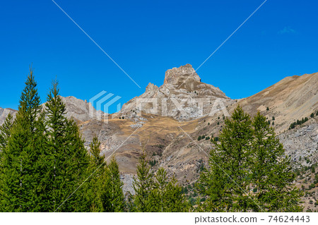 Landscape view of Col de la Cayolle pass and surrounding mountains in France Landscape view of Col de la Cayolle pass and surrounding mountains in France 74624443