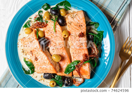 Salmon stew with cream sauce on a plate, top view Salmon stew with cream sauce on a plate, top view 74624596