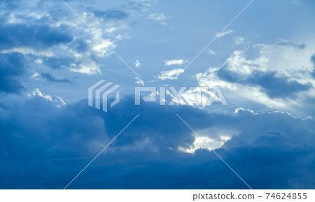 Deep blue sky with clouds, abstract nature background 74624855