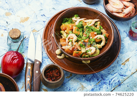 Salad with tamarillo,shrimps and avocado Salad with tamarillo,shrimps and avocado 74625220