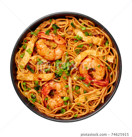 Mie Goreng isolated on white. Indonesian cuisine prawn noodles vegetables stir fired dish 74625915