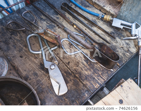 Shear scissors. Shaping diamond shear cutter and pliers in glassblower  shop 74626156