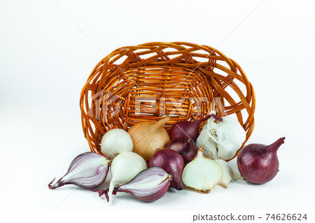 blue and white varieties of onion in a wicker basket blue and white varieties of onion in a wicker basket 74626624