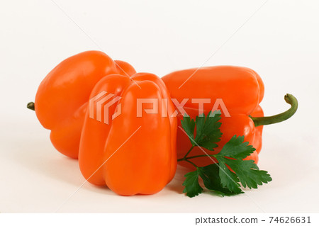 paprika,lettuce and parsley on a white background. paprika,lettuce and parsley on a white background. 74626631