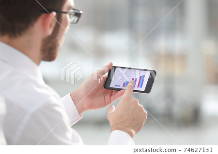Close up of a man using mobile smart phone Close up of a man using mobile smart phone 74627131