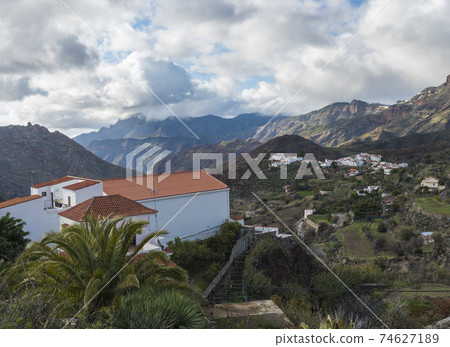 Picturesque Canarian village Tejeda in mountain valley scenery and view of Caldera de Tejeda Gran Canaria, Canary Islands, Spain 74627189