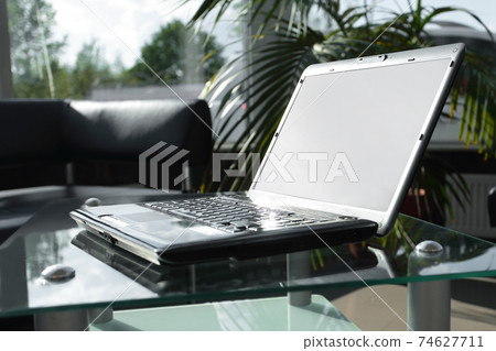 side view.work Desk in a modern office. business concept side view.work Desk in a modern office. business concept 74627711