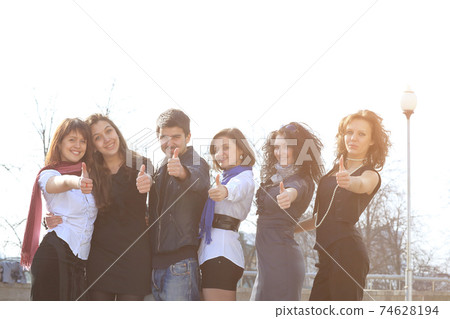 group of successful students showing thumb up group of successful students showing thumb up 74628194