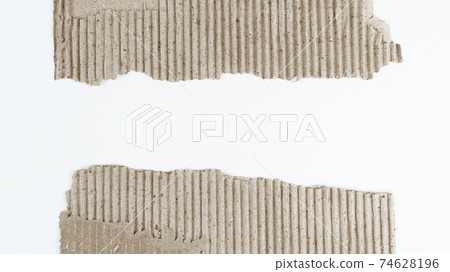 two torn piece of cardboard on white background two torn piece of cardboard on white background 74628196