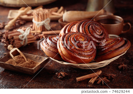 Freshly baked sweet cinnamon buns. Freshly baked sweet cinnamon buns. 74629244