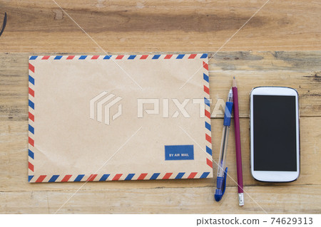 envelope air mail  letter confidential papers with mobile phone for business 74629313