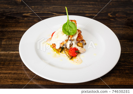 Grilled chicken breast, courgettes and eggplants marinated with olive oil, garlic and soy sauce. Grilled chicken breast, courgettes and eggplants marinated with olive oil, garlic and soy sauce. 74630281
