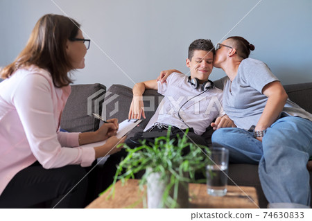 Mother with her teenage son at meeting with social worker, psychologist 74630833