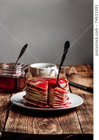 Stack of pancakes with berry fruit marmalade Stack of pancakes with berry fruit marmalade 74631091
