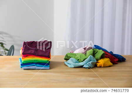Tidy and organized clothes with the konmari method Tidy and organized clothes with the konmari method 74631770