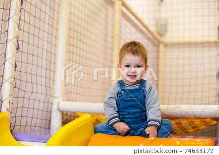 Smiling toddler at the indoor play center 74633172
