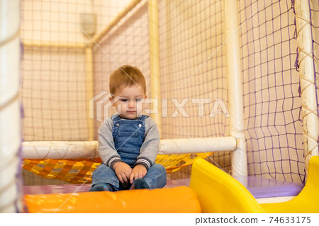 Smiling toddler at the indoor play center 74633175