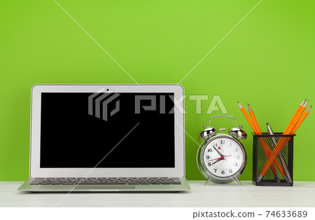 Studio workspace with laptop computer and office supplies Studio workspace with laptop computer and office supplies 74633689