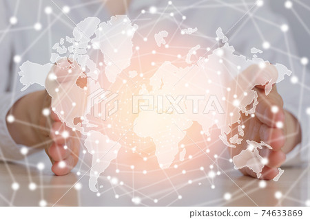 Globalization concept world map between the handprints of a girl. Globalization concept world map between the handprints of a girl. 74633869
