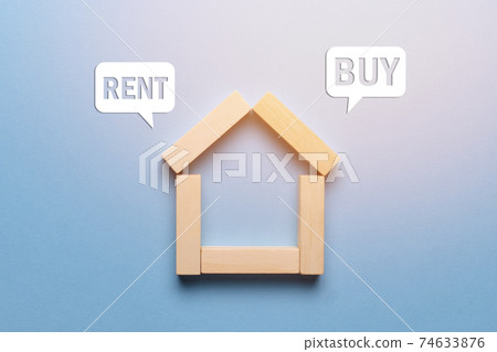 Concept of renting or buying real estate house made of wooden blocks with icons. 74633876