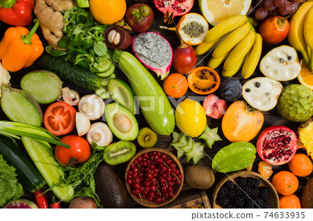 Topview raw vegetables,carrot and tometos and carot and ginger and green chilli and bell peper on wood table 74633935