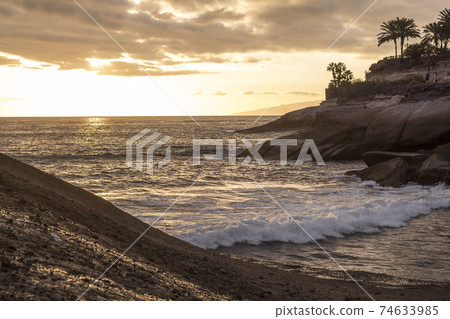 Calm Atlantic at small Tenerife bay at dusk Calm Atlantic at small Tenerife bay at dusk 74633985