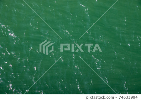 Green and shiny surface of calm Atlantic ocean Green and shiny surface of calm Atlantic ocean 74633994