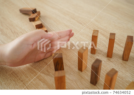 Businessmen use their hands to break the bar. Continuous falling. Hedging concept Preventing mistakes in business, losing money to retain benefits or haunting. 74634052