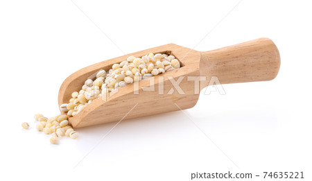 pile of pearl barley in wood scoop isolated on white pile of pearl barley in wood scoop isolated on white 74635221