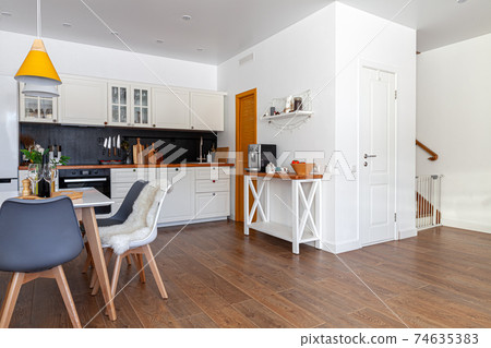 Modern design interior of dining room, kitchen, white furniture 74635383