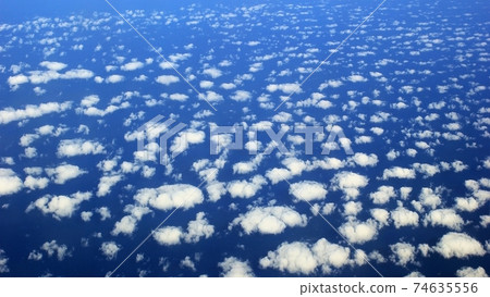 Flocks of clouds over the ocean Flocks of clouds over the ocean 74635556