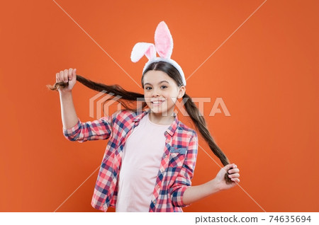 happy easter kid girl wearing ears for bunny hunt in easter 74635694
