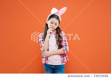 sad easter kid girl wearing ears for bunny hunt in easter holiday, mood sad easter kid girl wearing ears for bunny hunt in easter holiday, mood 74635696