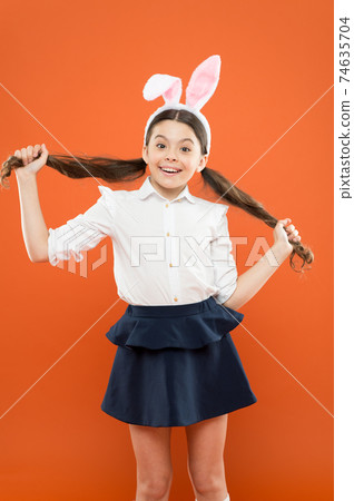 Impressive looking bunny. Little child celebrate Easter. Impressive looking bunny. Little child celebrate Easter. 74635704