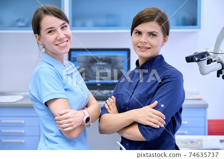 Team of two doctors women dentists in the dental office 74635737