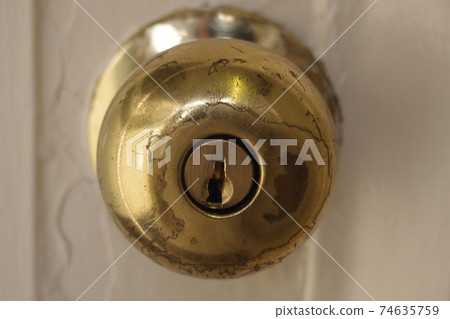 A keyhole of a door. 74635759