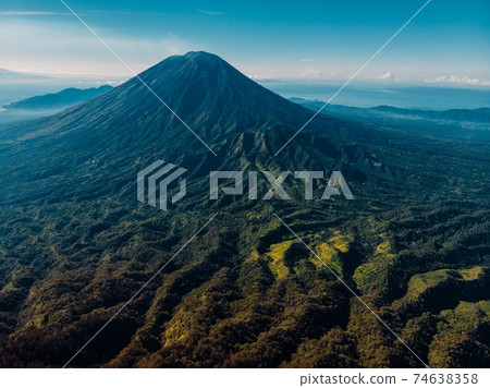 Aerial view of Agung volcano with forest in Bali, Indonesia 74638358