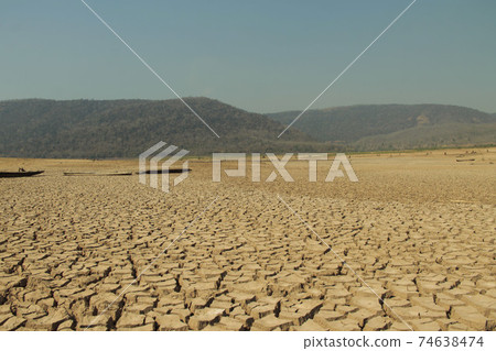 The drought land texture in Thailand. The global shortage of water on the planet. Global warming and greenhouse effect concept. The drought land texture in Thailand. The global shortage of water on the planet. Global warming and greenhouse effect concept. 74638474