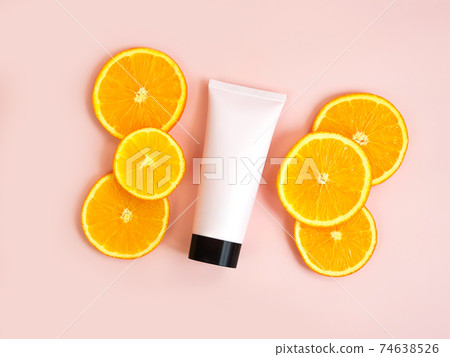 Mockup of pink squeeze bottle plastic tube with black cap orange slices on pink background. Bottle for branding and label. Natural organic spa cosmetics. Skincare, advertising concept. Mockup of pink squeeze bottle plastic tube with black cap orange slices on pink background. Bottle for branding and label. Natural organic spa cosmetics. Skincare, advertising concept. 74638526