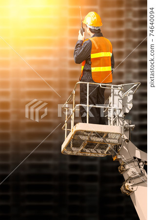 Engineer man in cabin basket 74640094