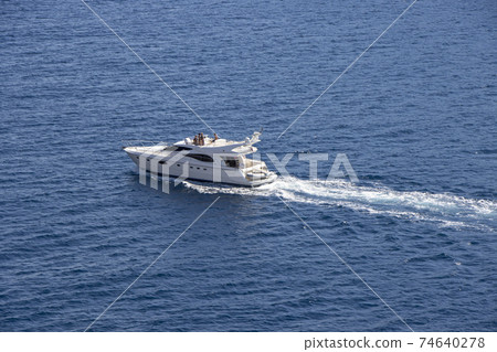 Small yacht Motor boat in the Adriatic Sea by the shore of Croatia 74640278