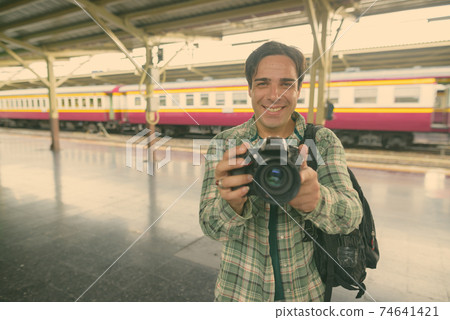 Handsome Persian tourist man at the railway station in Bangkok, Thailand Handsome Persian tourist man at the railway station in Bangkok, Thailand 74641421