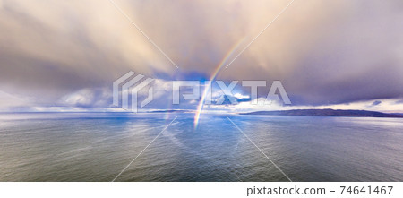 Aerial view of an rainbow above the Atlantic Ocean in Donegal - Ireland Aerial view of an rainbow above the Atlantic Ocean in Donegal - Ireland 74641467